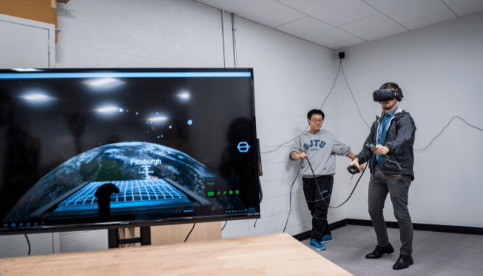 Students try virtual reality at an IDeATe Open House event.