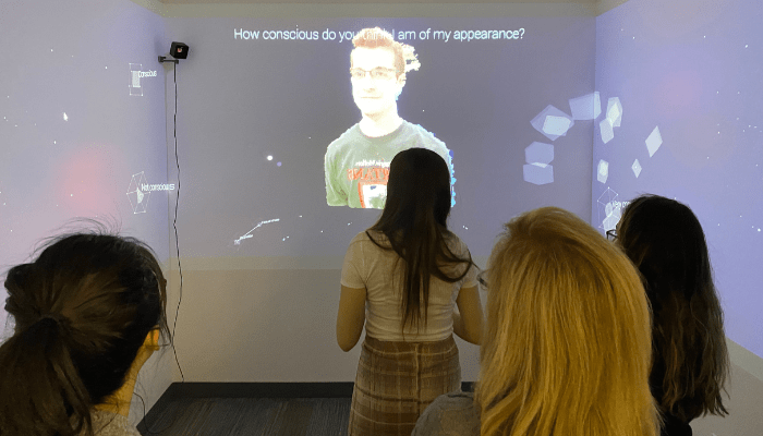 Visitors explore the Kenner Room exhibit Kaleidoscope an immersive experience created to explore unconscious bias.