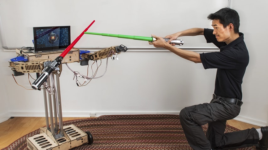 Student John Choi works on his robot