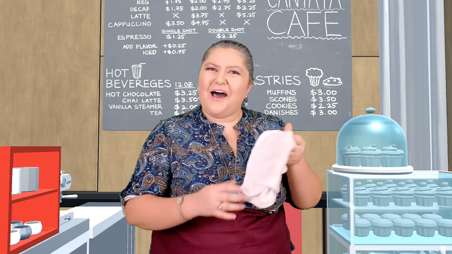 Woman who appears to be mid-song in front of a virtual background of a bakery/cafe