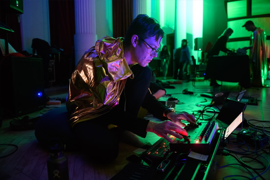 Professor Jesse Stiles mans one of the electronic music instruments at the Snoozefest event at Carnegie Mellon